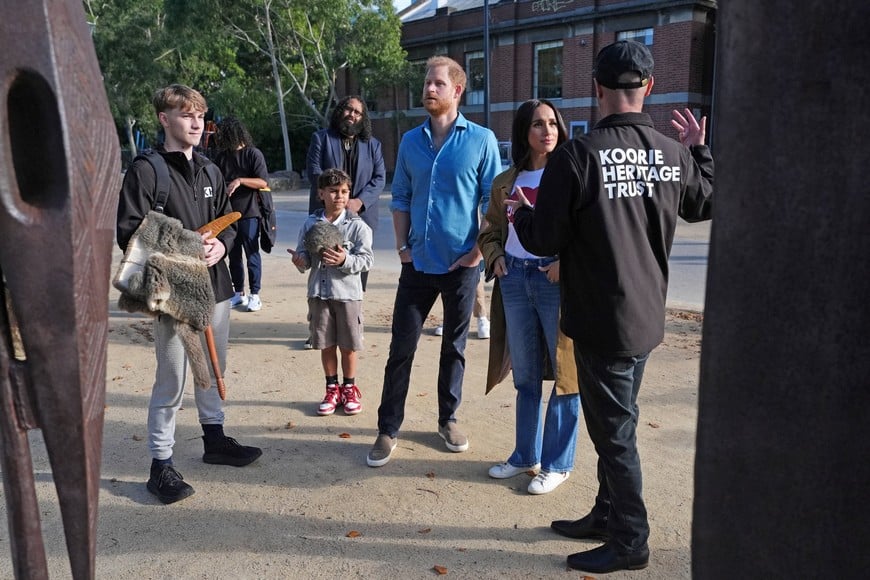 Britain's Prince Harry and Meghan, the Duke and Duchess of Sussex, meet representatives from the Koorie Heritage Trust before taking part in the Scar Tree Walk in Melbourne, Victoria, Australia, April 16, 2026. Jonathan Brady/Pool via REUTERS?