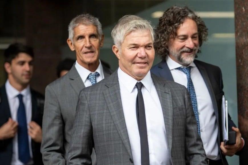 Fernando Burlando junto a Fabián Améndola (derecha)