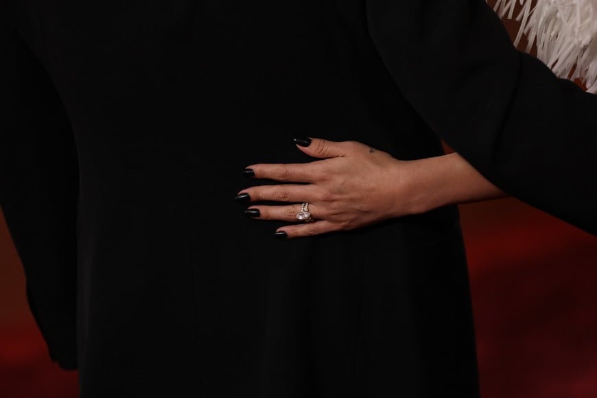 Selena Gomez and Benny Blanco pose on the red carpet at the 83rd Annual Golden Globes in Beverly Hills, California, U.S., January 11, 2026. REUTERS/Daniel Cole
