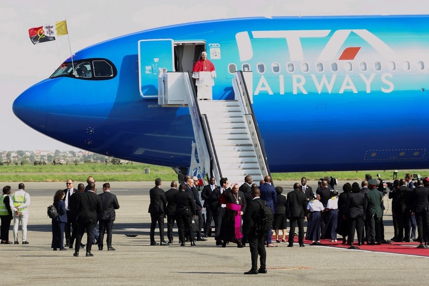 Pope Leo XIV disembarks the papal plane upon his arrival at Quatro de Fevereiro International Airport to begin his apostolic journey to Angola, in Luanda, Angola, April 18, 2026. REUTERS/Cesar Muginga