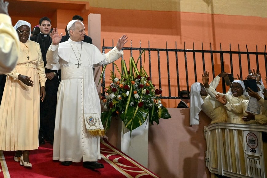 FILE PHOTO: Pope Leo XIV waves to supporters as he leaves after his visit to the Ngul Zamba (Power of God) orphanage in Yaounde, Cameroon, during an apostolic journey to Africa, on April 15, 2026.     ALBERTO PIZZOLI/Pool via REUTERS/File Photo