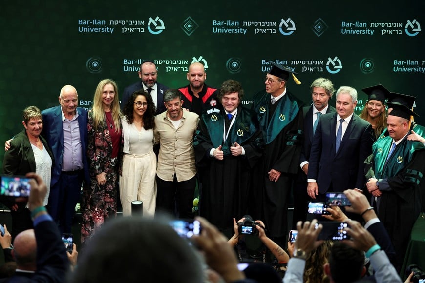 Argentina's President Javier Milei poses for a family photo after he received an honorary doctorate from Bar-Ilan University, which they say is in recognition of Milei's longstanding partnership with Israel and his fight against antisemitism, in Ramat Gan, Israel April 20, 2026. REUTERS/Florion Goga
