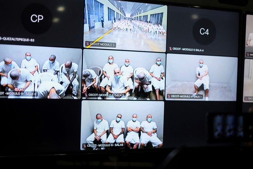 Members of Mara Salvatrucha, also known as MS-13 gang, are seen on a monitor as they attend an open hearing by El Salvador prosecutors against 486 members of the gang, who are accused of more than 47,000 crimes committed between 2012 and 2022, according to a statement from the Attorney General's Office, at the Judicial Center Against Organized Crime in Soyapango, El Salvador April 21, 2026. REUTERS/Jose Cabezas