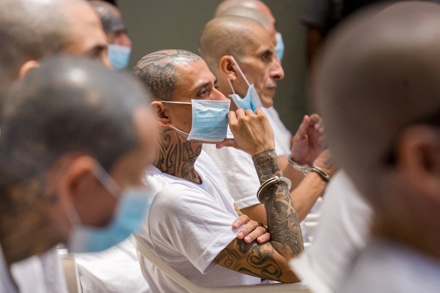 Members of Mara Salvatrucha, also known as MS-13 gang, attend an open hearing by El Salvador prosecutors against 486 members of the gang, who are accused of more than 47,000 crimes committed between 2012 and 2022, according to a statement from the Attorney General's Office, at the Terrorism Confinement Center (CECOT) in Tecoluca, El Salvador, April 20, 2026. Attorney General's Office of El Salvador/Handout via REUTERS ATTENTION EDITORS - THIS IMAGE HAS BEEN SUPPLIED BY A THIRD PARTY. NO RESALES. NO ARCHIVES.