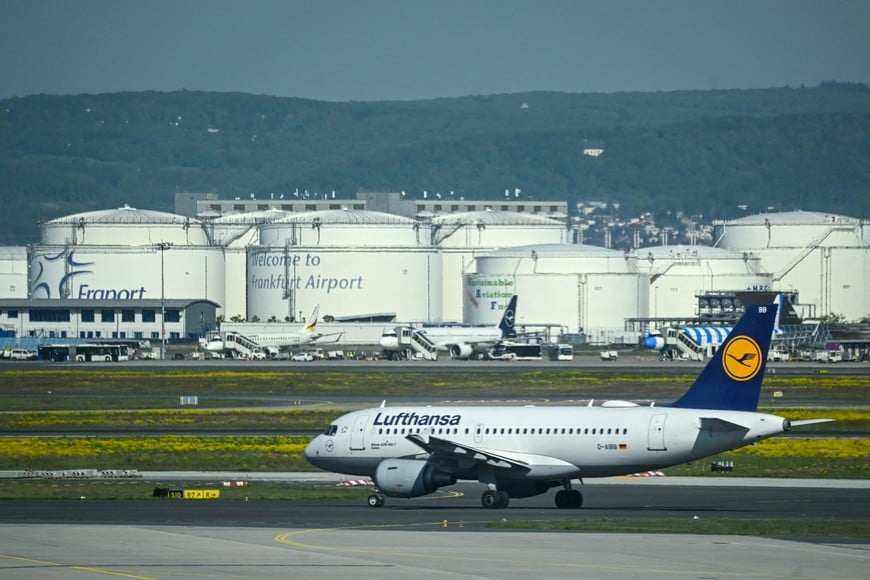 A Lufthansa plane moves on the runway near Kerosene tanks on the day of the official inauguration ceremony of Terminal 3 at Frankfurt Airport, in Frankfurt, Germany, April 22, 2026. REUTERS/Jana Rodenbusch