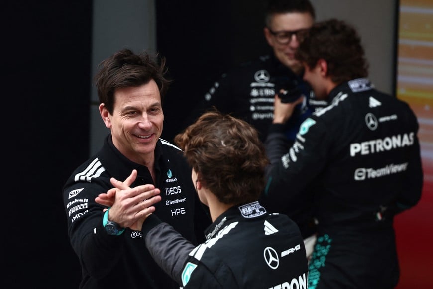 Formula One F1 - Chinese Grand Prix - Shanghai International Circuit, Shanghai, China - March 15, 2026
Mercedes' George Russell celebrates after finishing second place in the Chinese Grand Prix with Mercedes team principal Toto Wolff REUTERS/Jakub Porzycki