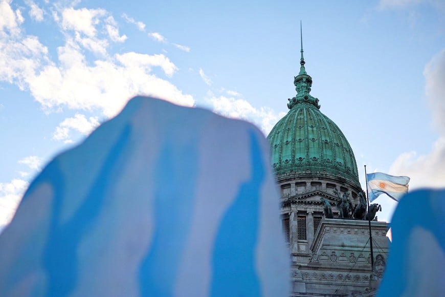 Cardboard glaciers are displayed outside the National Congress as deputies debate a new glaciers law promoted by Argentine President Javier Milei, which calls on provinces to redefine glacier protection zones to allow expanded mining operations, in Buenos Aires, Argentina, April 8, 2026. REUTERS/Agustin Marcarian