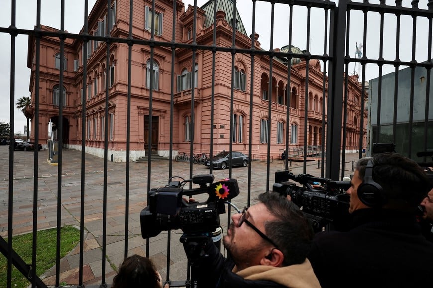 Members of the media work outside the Casa Rosada Presidential Palace a day after big defeat for Argentina's President Javier Milei in the legislative elections in the province of Buenos Aires, in Buenos Aires, Argentina September 8, 2025. REUTERS/Agustin Marcarian