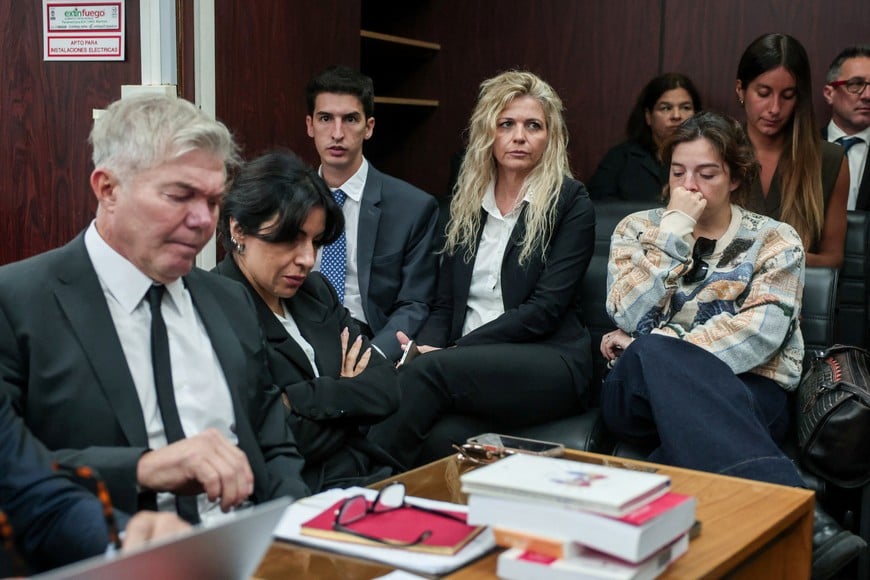 Gianinna and Dalma Maradona, daughters of late Argentine soccer legend Diego Armando Maradona, sit inside a court to attend a new trial against medical professionals facing accusations of negligence in connection to the 2020 death of the global icon, in Buenos Aires, Argentina, April 14, 2026. REUTERS/Cristina Sille