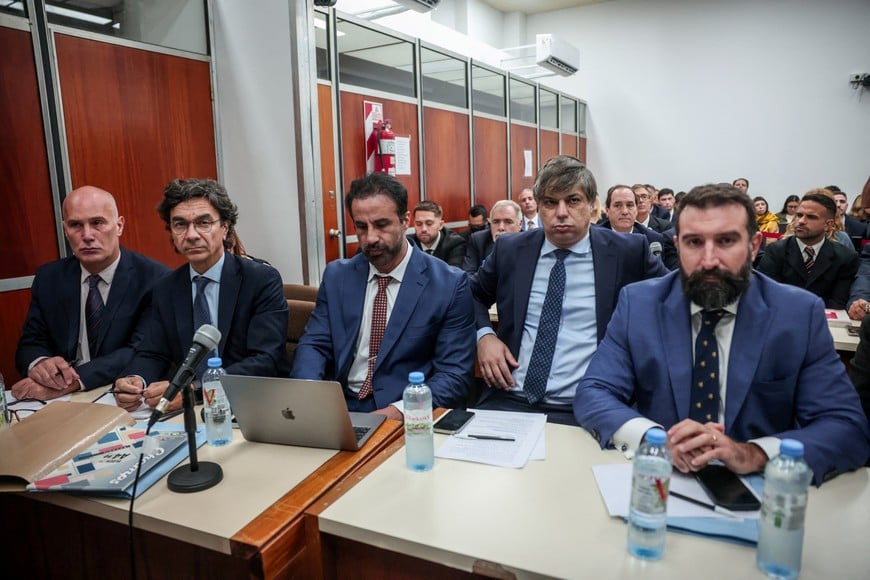 Vadim Mischanchuk, lawyer of Agustina Cosachov, psychiatrist of late Argentine soccer legend Diego Maradona, Francisco Oneto, lawyer of Maradona's personal doctor Leopoldo Luque, sit among other lawyers inside a court, as a new trial against medical professionals facing accusations of negligence in connection to the 2020 death of the global icon is set to start, in Buenos Aires, Argentina, April 14, 2026. REUTERS/Cristina Sille