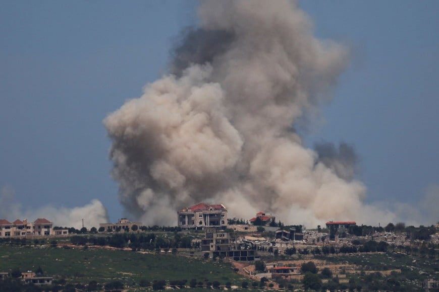 Smoke rises in Lebanon after an explosion, as seen from the Israeli side of the Israel-Lebanon border, in northern Israel, April 25, 2026. REUTERS/Florion Goga