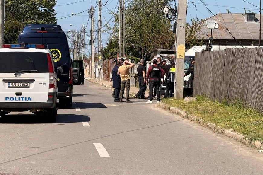 Law enforcement present in front of the house where a Russian drone crashed in Galati, Romania April 25, 2026. Picture taken using a mobile phone. Inquam Photos via REUTERS ATTENTION EDITORS - THIS IMAGE WAS PROVIDED BY A THIRD PARTY. ROMANIA OUT. NO COMMERCIAL OR EDITORIAL SALES IN ROMANIA