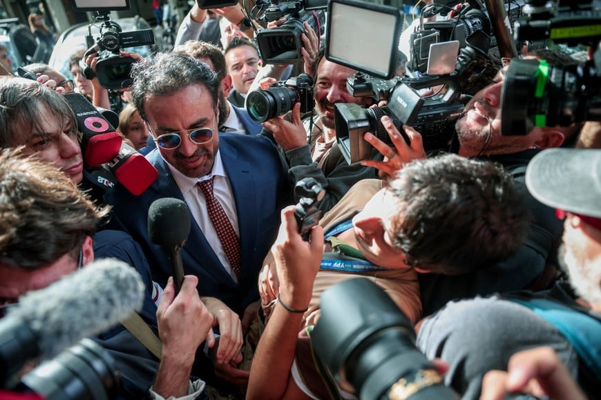 Leopoldo Luque, the personal doctor of late Argentine soccer legend Diego Armando Maradona, speaks to members of the media as he arrives at court to attend a new trial against medical professionals facing accusations of negligence in connection to the 2020 death of the global icon, in Buenos Aires, Argentina, April 14, 2026. REUTERS/Cristina Sille
