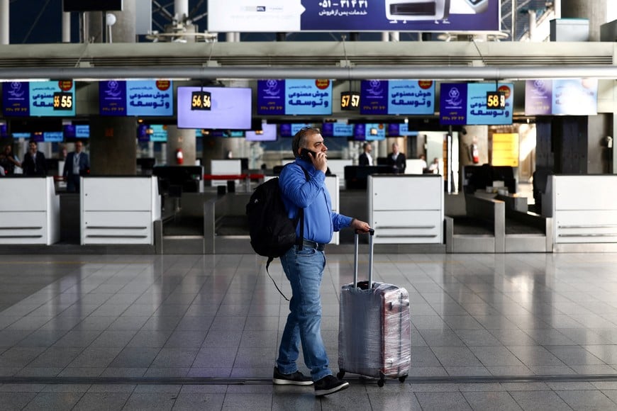 A passenger walks through the terminal hall after flights resumed at Imam Khomeini International Airport, amid a ceasefire between U.S. and Iran, in Tehran, Iran, April 25, 2026. Majid Asgaripour/WANA (West Asia News Agency) via REUTERS ATTENTION EDITORS - THIS PICTURE WAS PROVIDED BY A THIRD PARTY      TPX IMAGES OF THE DAY