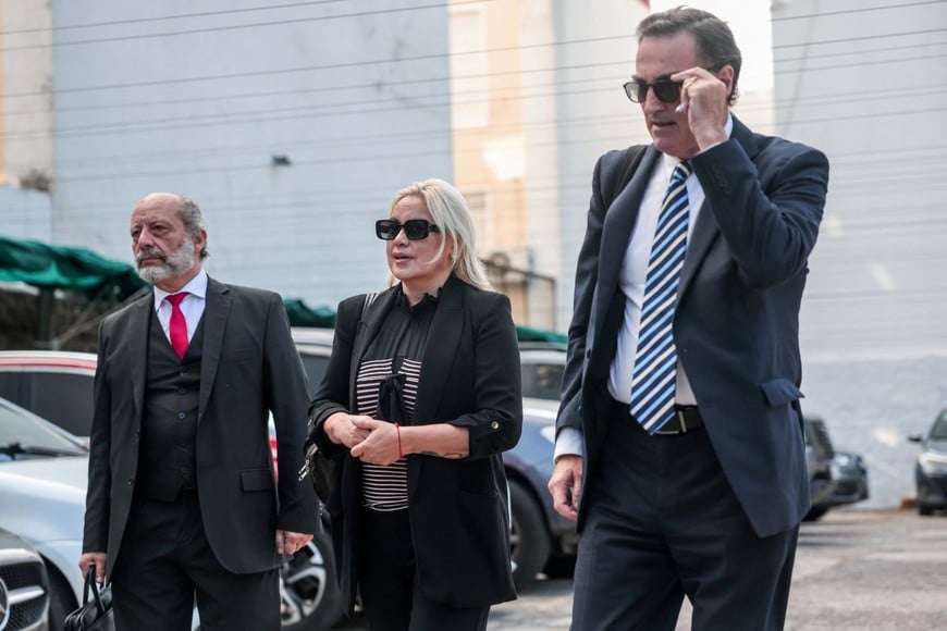 Veronica Ojeda, ex-girlfriend of Argentine soccer legend Diego Armando Maradona, and her lawyer Mario Baudry arrive at court to attend a new trial against medical professionals facing accusations of negligence in connection to the 2020 death of the global icon, in Buenos Aires, Argentina, April 14, 2026. REUTERS/Cristina Sille