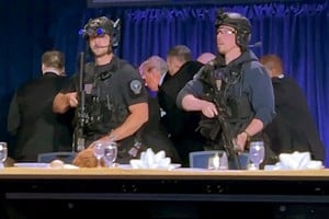 U.S. President Donald Trump is escorted out after a man opened fire with a shotgun on security personnel outside the room, during the annual White House Correspondents' Association dinner in Washington, D.C., U.S., April 25, 2026, in this still image from video. REUTERS/Bo Erickson THIS IMAGE WAS PROCESSED BY REUTERS TO ENHANCE QUALITY, AN UNPROCESSED VERSION HAS BEEN PROVIDED SEPARATELY.     TPX IMAGES OF THE DAY