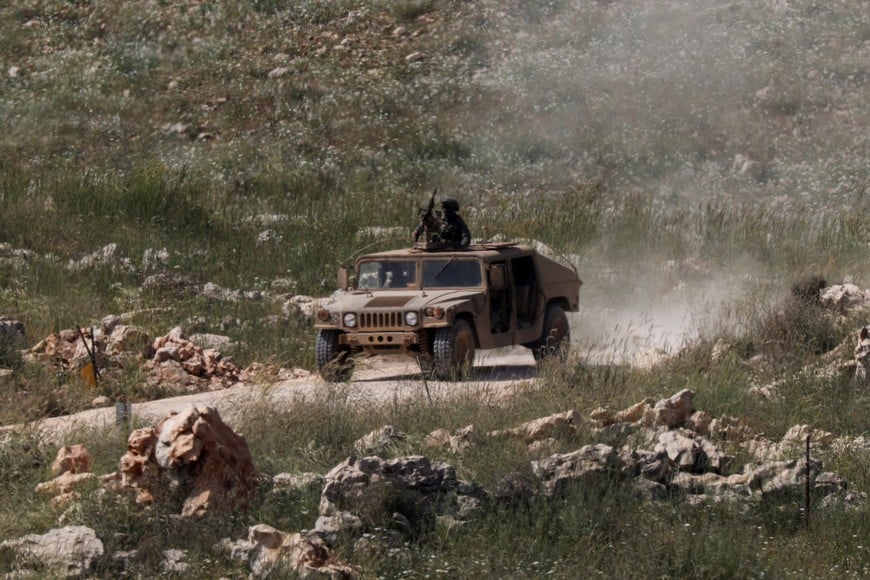 An Israeli armoured vehicle drives inside Lebanon, as seen from the Israeli side of the border with Lebanon, April 24, 2026. REUTERS/Florion Goga