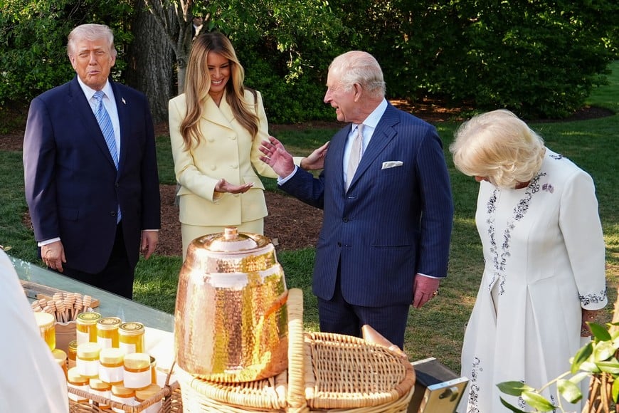 Britain's King Charles and Queen Camilla join US President Donald Trump and US First Lady Melania for a tour of the White House beehives in the grounds of the White House, on day one of the state visit to the US, in Washington D.C., U.S.,  April 27, 2026.    Aaron Chown/Pool via REUTERS