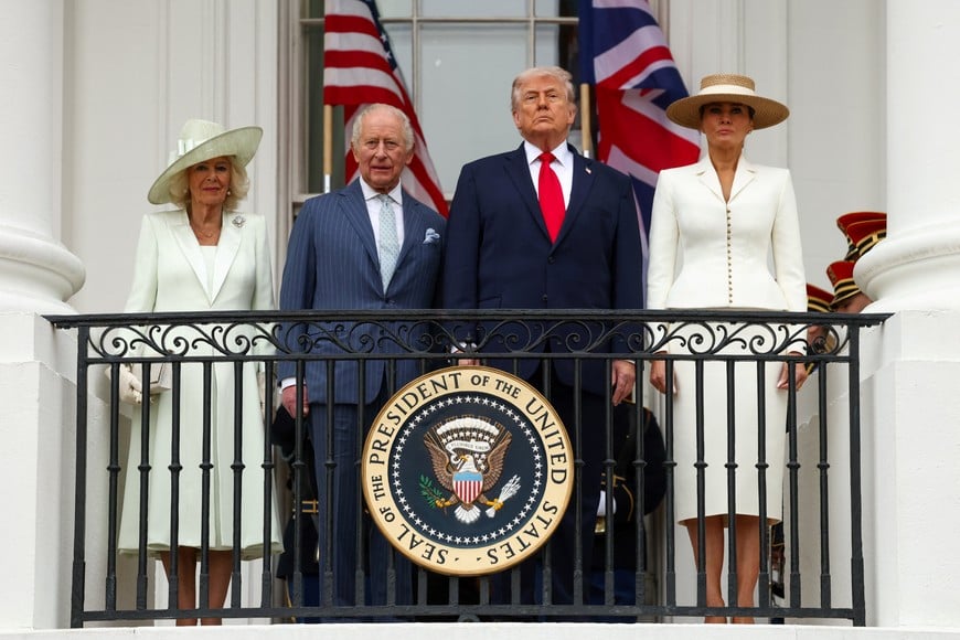 U.S. President Donald Trump, Britain's King Charles, Queen Camilla and U.S. first lady Melania Trump watch a pass in review during an arrival ceremony for the king and queen on the South Lawn of the White House, in Washington, D.C., U.S., April 28, 2026. REUTERS/Kevin Lamarque