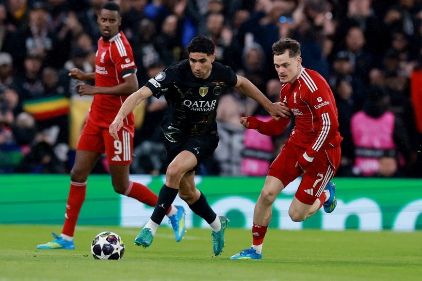 Soccer Football - UEFA Champions League - Quarter Final - Second Leg - Liverpool v Paris St Germain - Anfield, Liverpool, Britain - April 14, 2026
Paris St Germain's Achraf Hakimi in action with Liverpool's Florian Wirtz REUTERS/Phil Noble