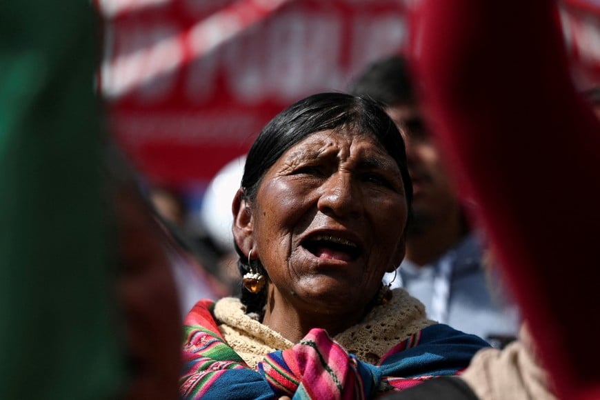 An Aymara woman sings the national anthem during a May Day protest organized by the Central Obrera Boliviana (COB), in El Alto, Bolivia, May 1, 2026. REUTERS/Claudia Morales REFILE - CORRECTING LOCATION FROM "LA PAZ" TO "EL ALTO".