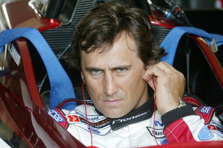 FILE PHOTO: Italian driver Alex Zanardi uses his ear sticks before sitting in the
cockpit of his specially modified car at the Eurospeedway Lausitzring
circuit in the eastern German town of Klettwitz May 11, 2003, before
the German 500 CART race. Zanardi returned on Sunday to the race track
in Germany where he lost both legs in a crash two years ago.
REUTERS/Fabrizio Bensch/File Photo