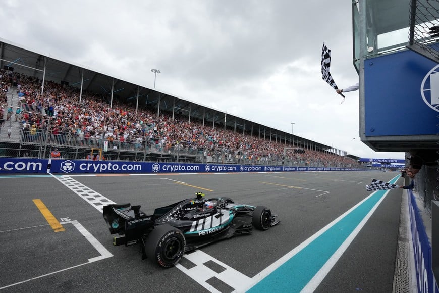 Formula One F1 - Miami Grand Prix - Miami International Autodrome, Miami, Florida, United States - May 3, 2026
Mercedes' Andrea Kimi Antonelli passes the chequered flag waved by former tennis player Rafael Nadal to win the Miami Grand Prix Pool via Reuters/Rebecca Blackwell