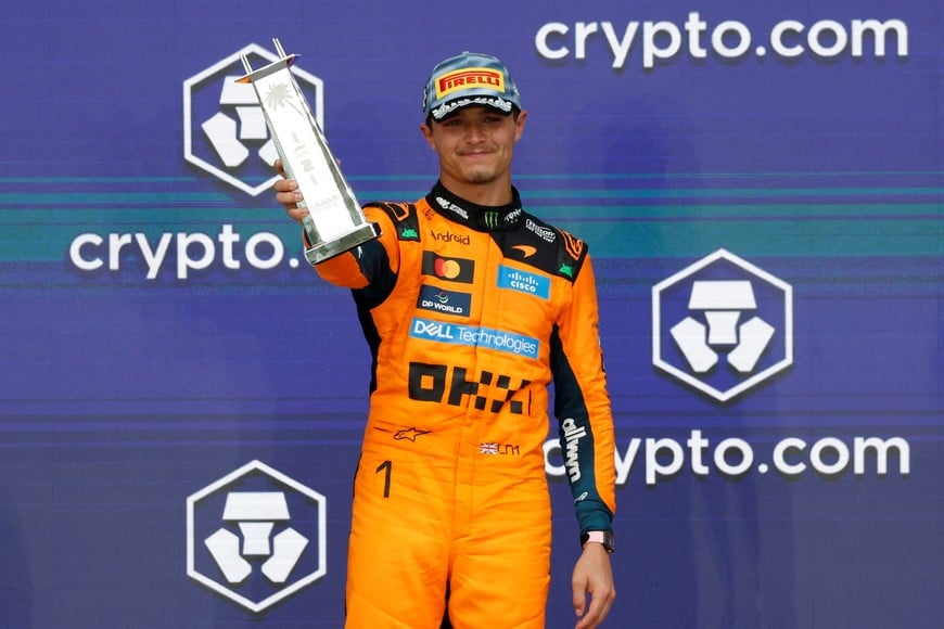 Formula One F1 - Miami Grand Prix - Miami International Autodrome, Miami, Florida, United States - May 3, 2026
McLaren's Lando Norris celebrates with a trophy on the podium after finishing second place in the Miami Grand Prix REUTERS/Marco Bello