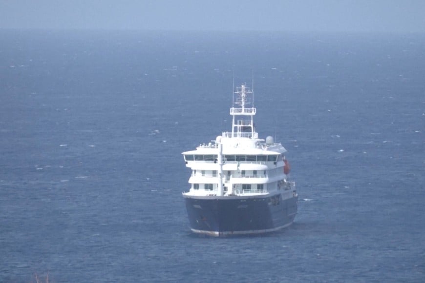 Cruise ship MV Hondius docks off Cape Verde port, as passengers were not allowed off the ship, while health authorities investigated suspected cases of hantavirus aboard the vessel, in Praia Port, Cape Verde, in this screengrab obtained from a video, May 4, 2026. REUTERS TV via REUTERS