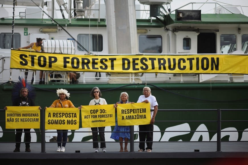 A banner is displayed on a Greenpeace ship that arrived carrying Brazilian Indigenous leaders, ahead of the United Nations Climate Change Conference (COP30), in Belem, Brazil, November 5, 2025. REUTERS/Adriano Machado