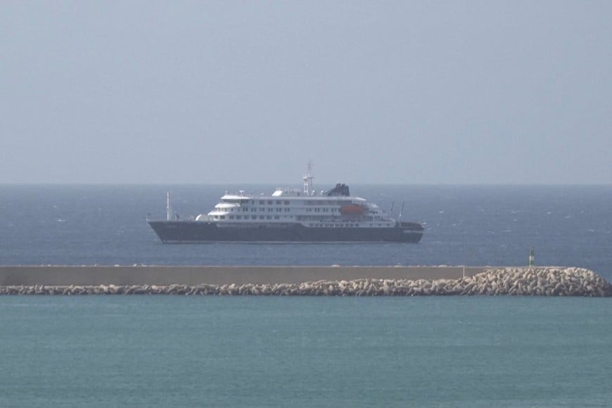 Cruise ship MV Hondius docks off Cape Verde port, as passengers were not allowed off the ship, while health authorities investigated suspected cases of hantavirus aboard the vessel, in Praia Port, Cape Verde, in this screengrab obtained from a video, May 4, 2026. REUTERS TV via REUTERS