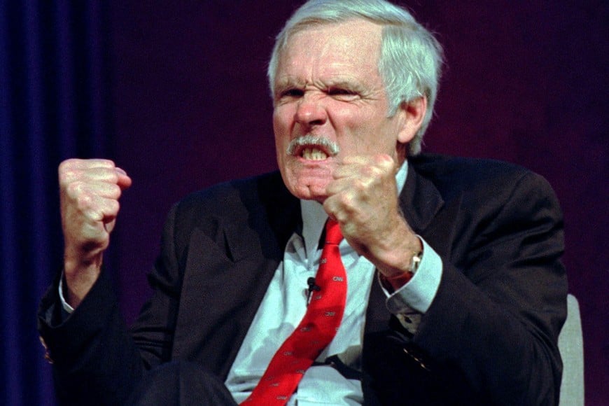 FILE PHOTO: Time Warner Inc. vice-chariman Ted Turner gestures after the moderator of a panel discussion at the Western Cable Show  mentioned the name of Rupert-Murdoch, head of News Corp Ltd. December 12 in Anaheim, California./File Photo
