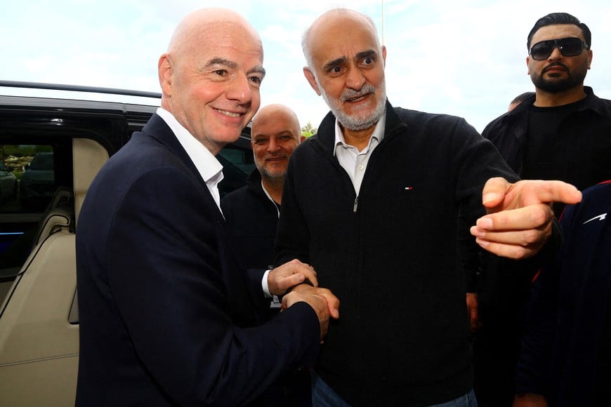Soccer Football - International Friendly - Costa Rica v Iran - Antalya Stadium, Antalya, Turkey - March 31, 2026
First vice president of the Islamic Republic of Iran Football Federation Mehdi Mohammad Nabi shakes hands with FIFA president Gianni Infantino before the match REUTERS/Kaan Soyturk     TPX IMAGES OF THE DAY