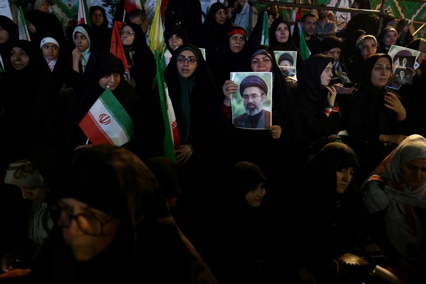 A woman holds a picture of Iran’s new Supreme Leader, Mojtaba Khamenei, during a rally in Tehran, Iran, May 6, 2026. Majid Asgaripour/WANA (West Asia News Agency) via REUTERS ATTENTION EDITORS - THIS PICTURE WAS PROVIDED BY A THIRD PARTY