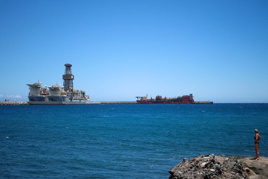 A woman looks out to the Granadilla port, where the cruise ship MV Hondius, is expected to arrive within three days, following a deadly hantavirus outbreak, at the port of Granadilla de Abona on the island of Tenerife in Spain, May 8, 2026. REUTERS/Hannah McKay