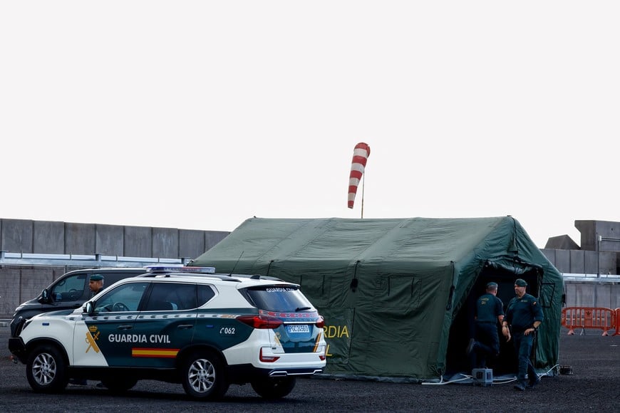 Members of the Spanish Civil Guard work at the port of Granadilla de Abona, Tenerife, Canary Islands, Spain, where the cruise ship MV Hondius hit by a deadly hantavirus outbreak is expected to arrive, May 9, 2026. REUTERS/Borja Suarez