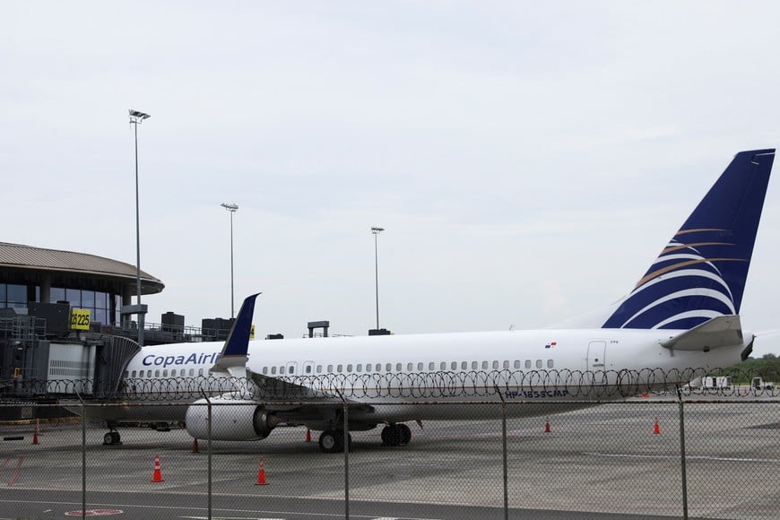 A Copa Airlines aircraft sits in the tarmac at Tocumen International Airport as flights between Panama and Venezuela resume nearly a year after being suspended amid a diplomatic standoff between the two countries, in Panama City, Panama May 27, 2025. REUTERS/Aris Martinez