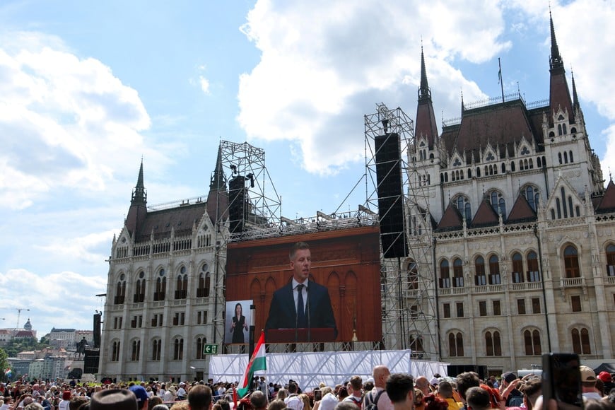 A screen shows the moment the new Prime Minister of Hungary, Peter Magyar, delivers a speech, while the crowd gathered outside the Hungarian Parliament building watches the inaugural session of the parliament in Budapest, Hungary, on May 9, 2026. REUTERS/Leonhard Foeger