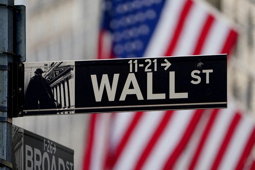 FILE PHOTO: The Wall Street sign is pictured at the New York Stock Exchange in the Manhattan borough of New York City, New York, U.S., March 9, 2020. REUTERS/Carlo Allegri///File Photo