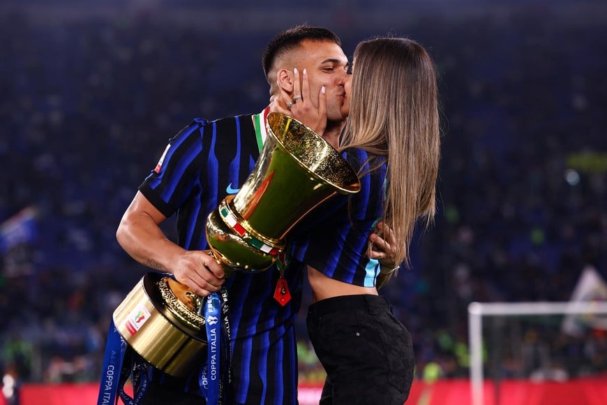 Soccer Football - Coppa Italia - Final - Lazio v Inter Milan - Stadio Olimpico, Rome, Italy - May 13, 2026
Inter Milan's Lautaro Martinez celebrates with the trophy and partner Agustina Gandolfo after winning the Coppa Italia REUTERS/Guglielmo Mangiapane