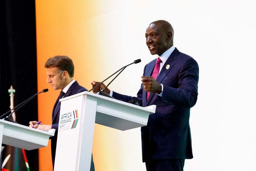 Kenya's President William Ruto speaks next to French President Emmanuel Macron during the closing of the "Africa Forward" Summit 2026 at the Kenyatta International Conference Centre (KICC), in Nairobi, Kenya, May 12, 2026. REUTERS/Thomas Mukoya