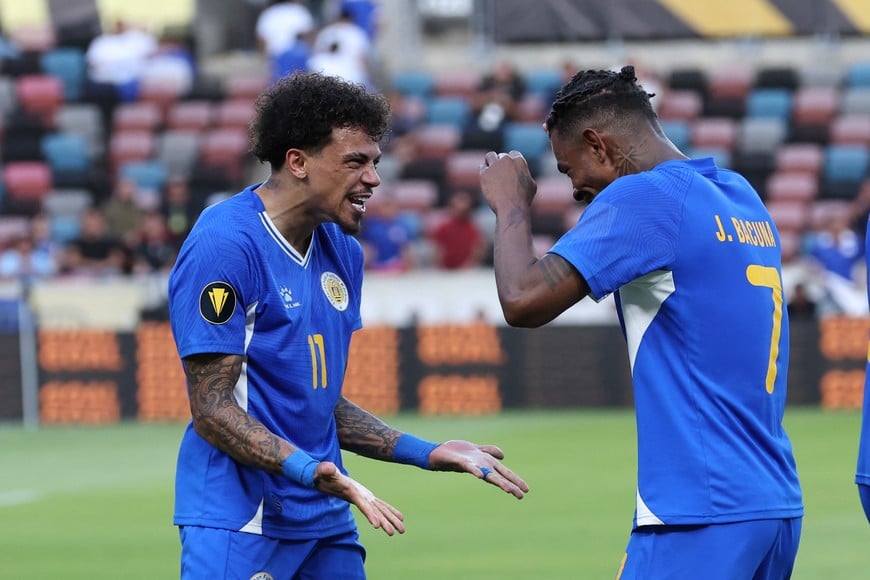 Jun 21, 2025; Houston, Texas, USA; Curacao forward Jeremy Antonisse (11) celebrates withCuracao midfielder Juninho Bacuna (7) after the game against Canada during a group stage match of the 2025 Gold Cup at Shell Energy Stadium. Mandatory Credit: Troy Taormina-Imagn Images