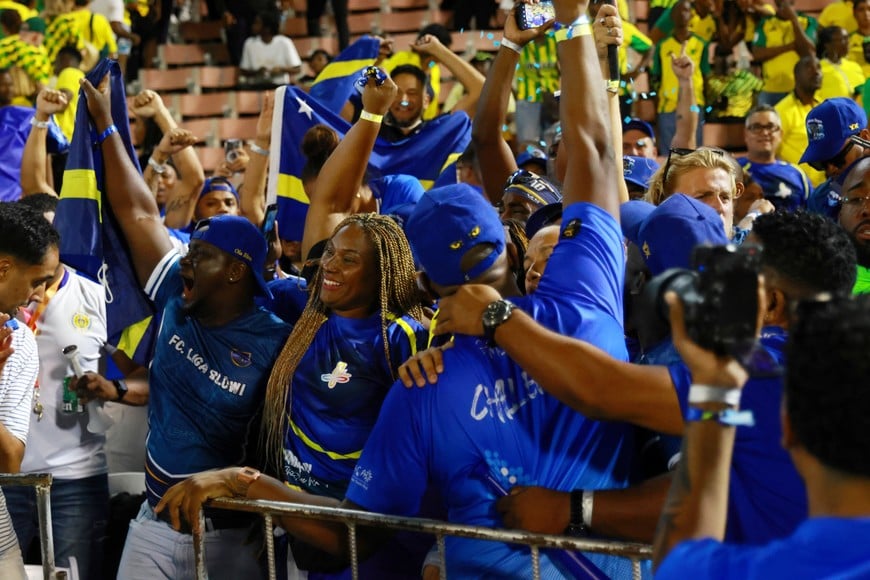 Soccer Football - FIFA World Cup - CONCACAF Qualifiers - Group B - Jamaica v Curacao - National Stadium Independence Park, Kingston, Jamaica - November 18, 2025
Curacao fans celebrate after they qualify for the World Cup REUTERS/Gilbert Bellamy