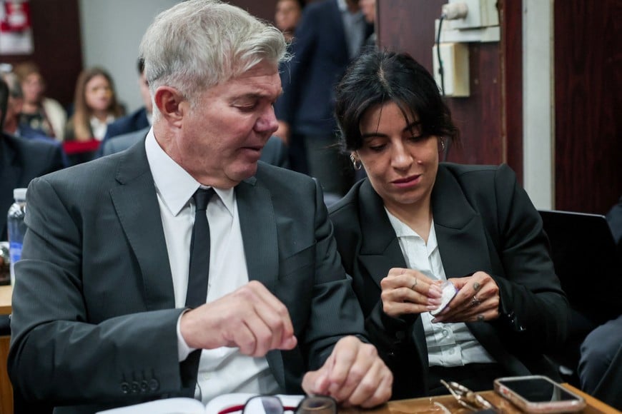 Gianinna Maradona, daughter of late Argentine soccer legend Diego Armando Maradona, speaks with her lawyer Fernando Burlando inside a court, as a new trial against medical professionals facing accusations of negligence in connection to the 2020 death of the global icon is set to start, in Buenos Aires, Argentina, April 14, 2026. REUTERS/Cristina Sille