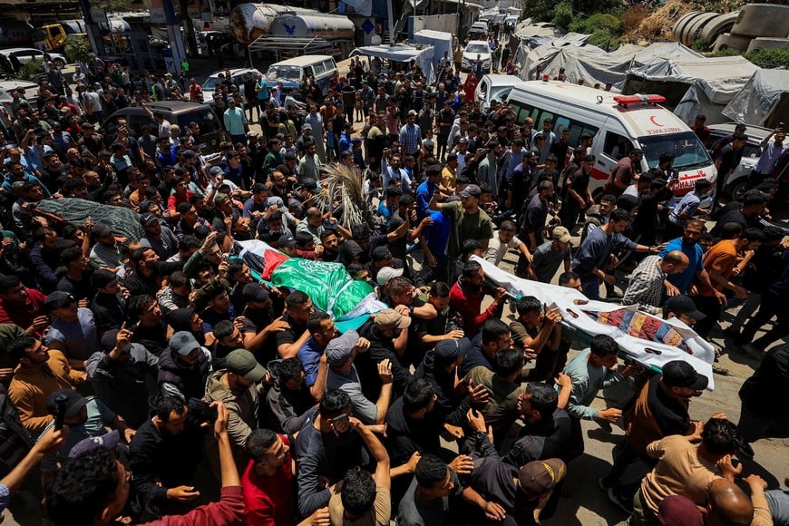People carry bodies identified by mourners as Hamas' military wing commander Izz al-Din al-Haddad, his wife and his daughter, who were killed in an Israeli strike on Friday, during a funeral, in Gaza City, May 16, 2026. REUTERS/Dawoud Abu Alkas