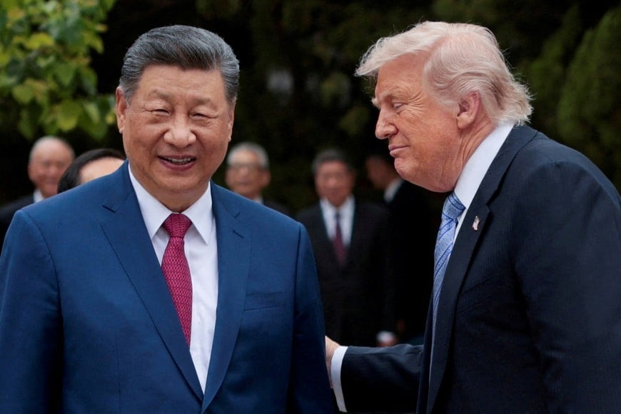 FILE PHOTO: FILE PHOTO: U.S. President Donald Trump speaks with Chinese President Xi Jinping while leaving after a visit to the Zhongnanhai Garden in Beijing, China, May 15, 2026. REUTERS/Evan Vucci/Pool/File Photo/File Photo
