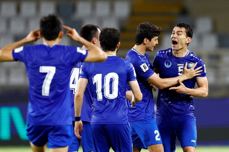 Soccer Football - World Cup - AFC Qualifiers - Group A - United Arab Emirates v Uzbekistan - Al Nahyan Stadium, Abu Dhabi, United Arab Emirates - June 5, 2025
Uzbekistan's Abdukodir Khusanov and Uzbekistan's Rustamjon Ashurmatov react REUTERS/Rula Rouhana