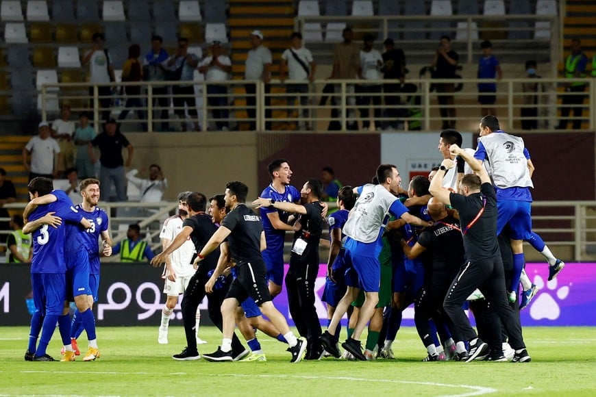 Soccer Football - World Cup - AFC Qualifiers - Group A - United Arab Emirates v Uzbekistan - Al Nahyan Stadium, Abu Dhabi, United Arab Emirates - June 5, 2025
Uzbekistan celebrate after qualifying for the 2026 World Cup REUTERS/Rula Rouhana