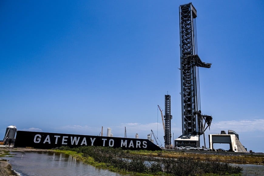 Preparations continue at launch pad 2, at right, for the 12th test flight of the Starship spacecraft and the Super Heavy booster in Starbase, Texas, U.S., May 16, 2026. In addition to being the inaugural voyage of both the V3 Starship and Super Heavy, the upcoming launch will mark the first blastoff from the new launch pad designed for the more powerful rocket. REUTERS/Steve Nesius