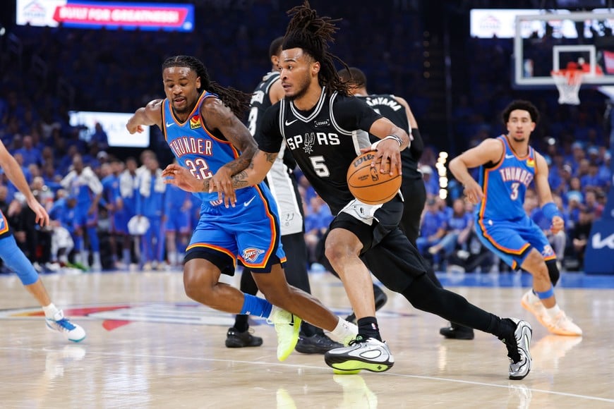 May 18, 2026; Oklahoma City, Oklahoma, USA; San Antonio Spurs guard Stephon Castle (5) drives the ball while defended by Oklahoma City Thunder guard Cason Wallace (22) in the second quarter during game one of the western conference finals for the 2026 NBA playoffs at Paycom Center. Mandatory Credit: Alonzo Adams-Imagn Images